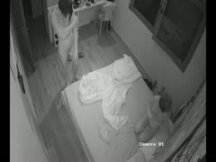 A concealed camera in the bedroom captures a woman having sex and masturbating.